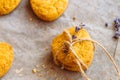 Freshly baked heart-shaped cookies on parchment paper, lavender flower