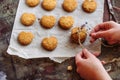 Freshly baked heart-shaped cookies on parchment paper, lavender flower