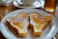 Freshly Baked Heart Shaped French Toast Served for Breakfast with Powdered Sugar and Syrup on a Wooden Table Royalty Free Stock Photo