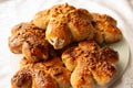 Freshly baked homemade buns with nut topping. Cocoa dough. Tasty, appetizing homemade cakes on a white background