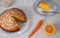 Freshly baked homemade cake of carrots and almonds. One piece ready to eat. Clear background and orange color Royalty Free Stock Photo