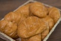 Freshly baked homemade croissants on wooden cutting board, top view Royalty Free Stock Photo