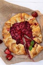 Freshly baked homemade galette or open strawberry pie and fresh mint leaves, summer food. Soft selective focus Royalty Free Stock Photo