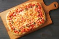 Homemade Pizza Alla Pala on a Wooden Breadboard