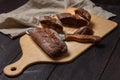 Freshly baked homemade rye bread with herbs and garlic butter. Sliced on a cutting Board. Royalty Free Stock Photo