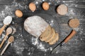 Freshly baked homemade rye sourdough bread. Sliced. spoon and eggs lie side by side. View from above Royalty Free Stock Photo