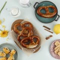 Baked Homemade Soft Pretzel Bavarian Brezel with Salt on Pastel Mint Table. Perfect for Octoberfest. Top View with Copy