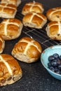 Freshly baked hotcross buns on a granite work surface Royalty Free Stock Photo