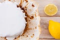 Freshly baked lemon cake with white icing and fresh lemons Royalty Free Stock Photo
