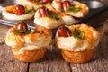 Freshly baked muffins with sausage, cheese and onion closeup. ho Royalty Free Stock Photo