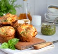 Freshly baked muffins with spinach, sweet potatoes and feta cheese on white background. Healthy food concept. Savory pastry