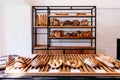 Freshly baked nut and raisin bread, spelt bread, bacon fougasse, confit cherry tomatoes fougasse, nuage and baguette Royalty Free Stock Photo