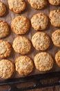 Freshly baked oatmeal Anzac cookies close up on a baking sheet. Royalty Free Stock Photo
