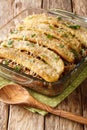 Freshly baked pastelon de Platano Maduro casserole close-up in a baking dish. vertical