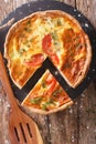 Freshly baked pie with feta cheese, tomatoes and herbs closeup. Royalty Free Stock Photo