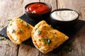 Freshly baked pizza calzone with sauces close-up. horizontal Royalty Free Stock Photo