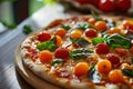 Freshly baked pizza with cherry tomatoes and basil on a wooden table