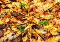 Freshly baked pizza with salami, mussels and shrimp, fried chunk Royalty Free Stock Photo