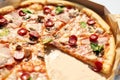 Delicious Pizza With Tomato, Cheese, and Greens in a Cardboard Box Outdoors