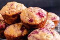 Freshly Baked Raspberry Muffins Piled on a Wire Cooling Rack Close Up Royalty Free Stock Photo