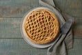 Freshly baked rhubarb pie and cake server on wooden table, flat lay