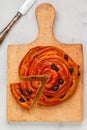 Freshly baked round cut bun with raisins Royalty Free Stock Photo