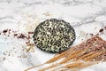Freshly Baked Round White Bread Roll with Black Sesame Seeds and Wheat Royalty Free Stock Photo