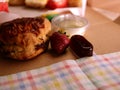 Freshly baked scone topped for cream tea close up shot Royalty Free Stock Photo