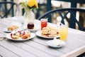 freshly baked scones, jams, and cream on a cafe table Royalty Free Stock Photo