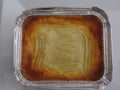 Freshly baked shepherd`s pie in an aluminium container