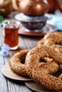 Freshly baked simit baked goods with sesame seeds close-up Turkish bagel - Gevrek or Kuluri. Traditional white bread with sesame