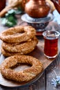 Freshly baked simit baked goods with sesame seeds close-up Turkish bagel - Gevrek or Kuluri. Traditional white bread with sesame