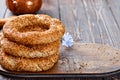 Freshly baked simit on a wooden table - sesame bun with copy space Turkish bagel - gevrek or kuluri. Traditional white bread Royalty Free Stock Photo
