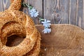 Freshly baked simit on a wooden table - sesame seed bun flat lay with copy space Turkish bagel - Gevrek or Kuluri. Traditional