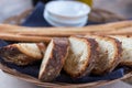 Freshly baked sliced bread on rustic wooden table, close up of brown bread. Royalty Free Stock Photo