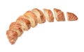 Freshly baked sliced croissant on white isolated background. Top side view.