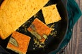 Sage Cornbread Cut Into Pieces in a Cast-Iron Skillet Close-up Royalty Free Stock Photo