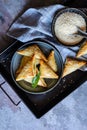 Spanakopita triangles stuffed with spinach and Feta cheese