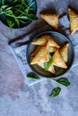 Spanakopita triangles stuffed with spinach and Feta cheese