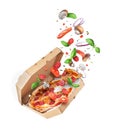 Freshly baked spicy pizza with various ingredients in the air isolated on a white background