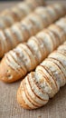 Freshly baked spiral breads with salt crust on burlap surface Royalty Free Stock Photo