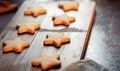 Freshly Baked Star Shaped Christmas Cookies On Board Ready For Decoration Royalty Free Stock Photo