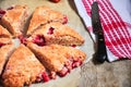 Freshly baked strawberry scone segments with pieces of berries o Royalty Free Stock Photo