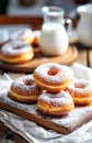 Freshly Baked Sugared Donuts Served on Wooden Board With Milk