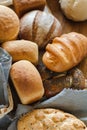 Freshly baked tasty white flour rhye and multi grain floor loafs of rectangular round and oval breads and plaited challah bread at Royalty Free Stock Photo