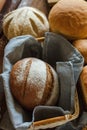 Freshly baked tasty white flour rhye and multi grain floor loafs of rectangular round and oval breads and plaited challah bread at Royalty Free Stock Photo