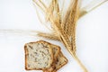 Freshly baked traditional bread with ears of wheat. Royalty Free Stock Photo