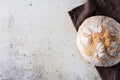 Freshly baked traditional bread on white rustic background