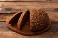 Freshly baked traditional bread on wooden table Royalty Free Stock Photo