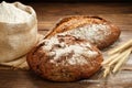 Freshly baked traditional bread on a wooden table Royalty Free Stock Photo